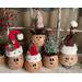 Here is a group of handmade Christmas gourds. Each elf has a custom hat and a cute elf facial expression carved out of their gourd shell.